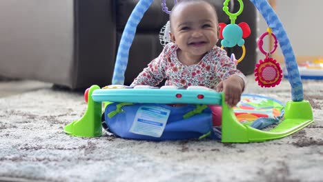 Baby-playing-with-piano-toy-at-home