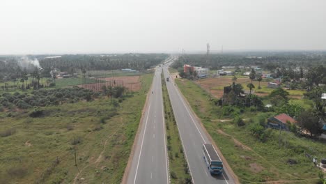 Flying-up-the-middle-lane-of-the-highway-in-a-rural-area-of-India