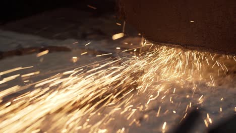 sparks from metal grinding machine. industrial concept grinding metal with sparks. metal milling machine during grinding out the metal detail in factory. metal grinding machine with sparks