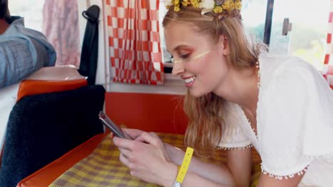 woman using mobile phone while talking to man in camper van 4k