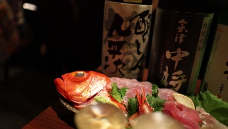 hands arranging a sushi platter delicately