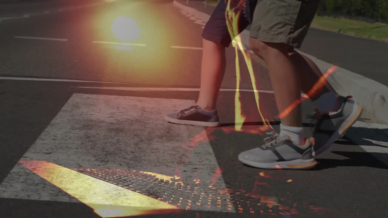 Father guiding sons walking across crosswalk after confirming clear road, showing pedestrian safety