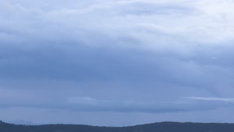 changing cloudscape over a tranquil landscape