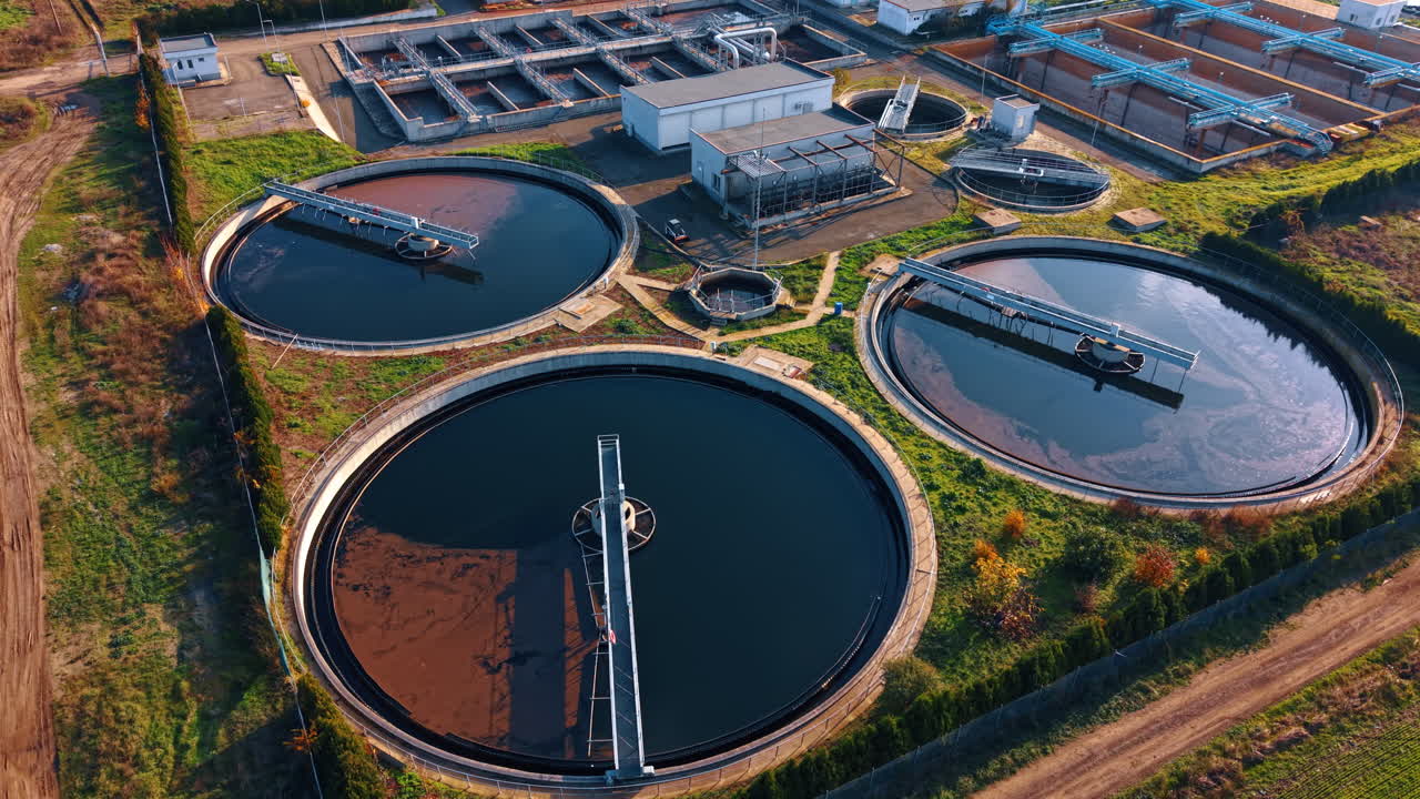 Three large full wastewater reservoirs in the water treatment plant. Recycling and saving natural resources. Aerial view