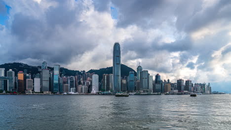 time lapse of clouds moving over victoria harbour hong kong skyline in spring afternoon