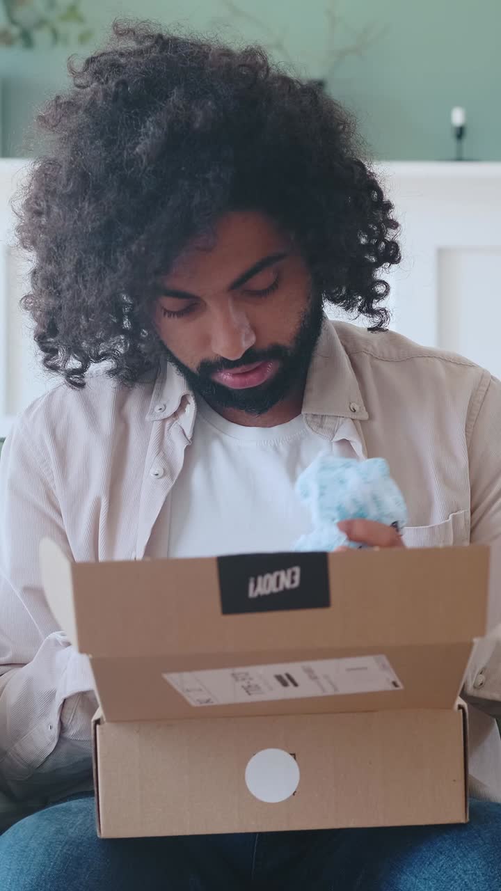 Unboxing a surprise delivery in a cozy indoor setting with excitement