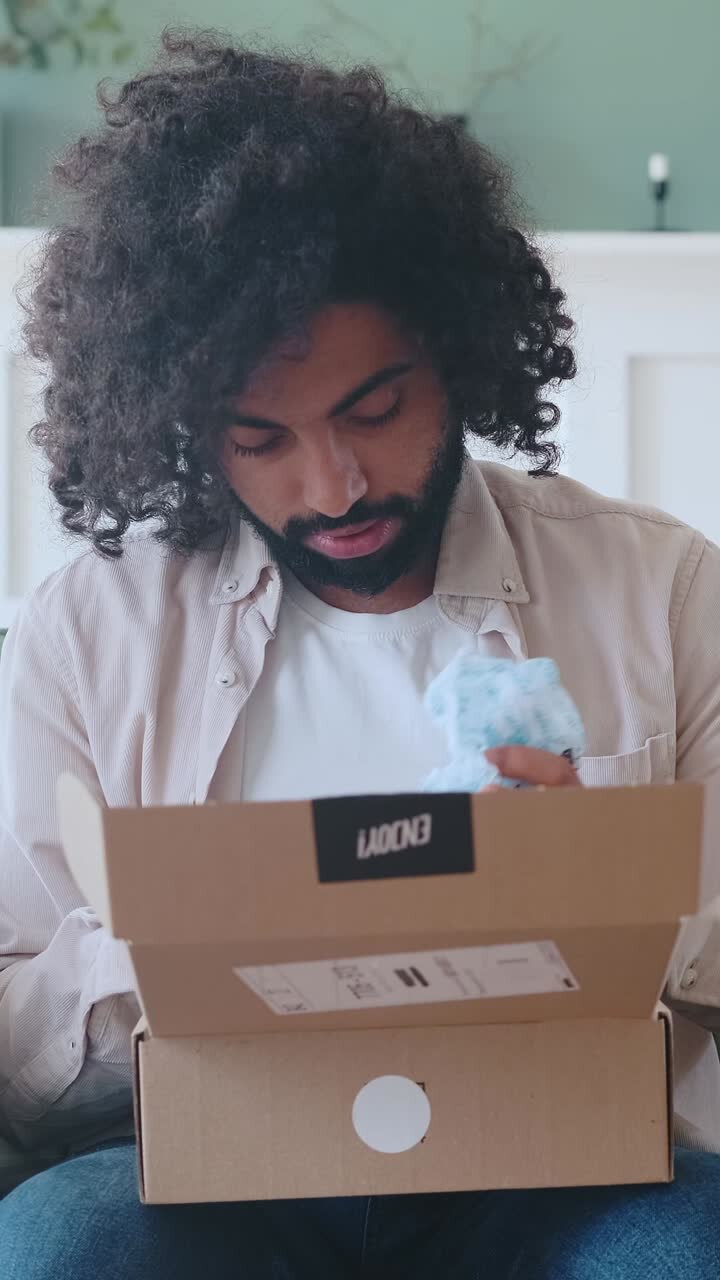Unboxing a surprise delivery in a cozy indoor setting with excitement