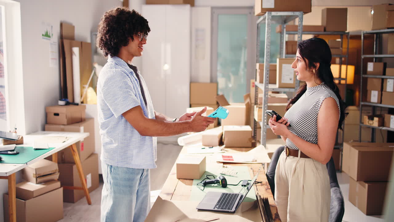 Entrepreneurs Collaborating in Small Business E-commerce Warehouse