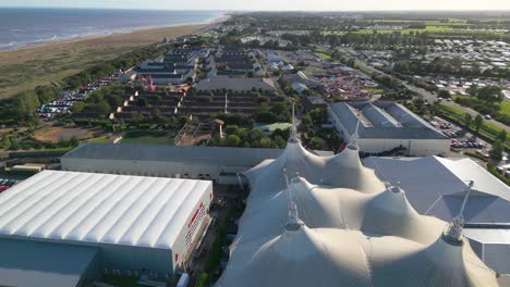 Aerial-drone-footage-of-the-famous-Butllins-holiday-camp-based-in-the-seaside-town-of-Skegness-Lancashire,-UK