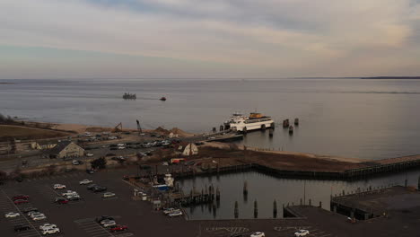 an-aerial-shot-of-the-Orient-Point-ferry-docked,-as-it-takes-on-vehicles-and-passengers-for-the-next-trip