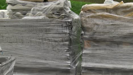 close up view of landfill with bags of asbestos and other trashes