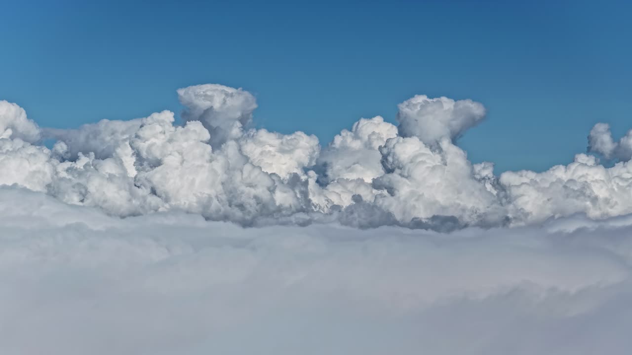 Aerial view of white fluffy clouds creating a heavenly calm scene