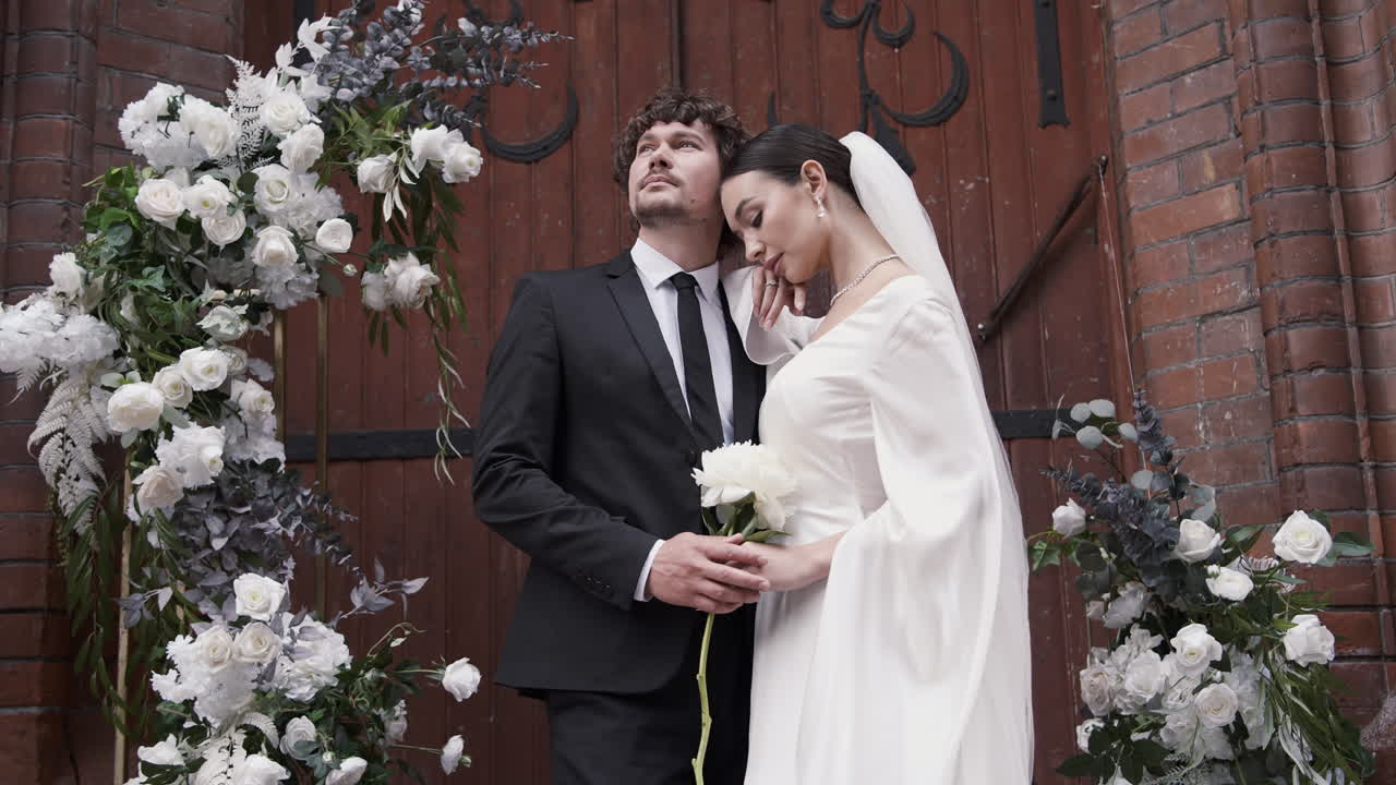 Wedding Couple in Front of Church Doors