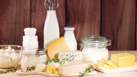 various dairy items displayed on a wooden surface