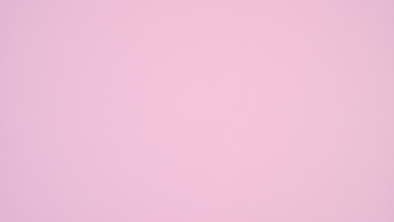 Valentine's day hearts hanging on rope on pastel pink theme. Stop motion