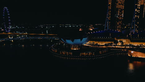 singapore night skyline with marina bay sands and flower dome