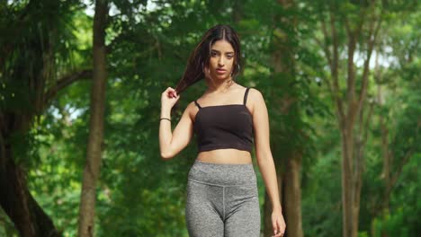 a young girl in sports gear adds vitality to the tropical park with her exercise routine