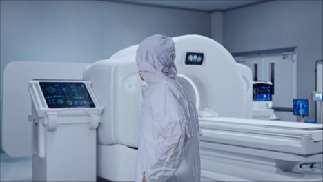 side view of asian male scientist putting hands on his hip and looking around with mri machine in the hospital
