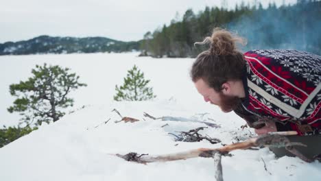 person making bonfire during winter season. close up