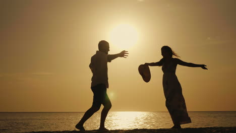 emotionally enjoy the holiday by the sea young couple hugging joyfully against the backdrop of the s