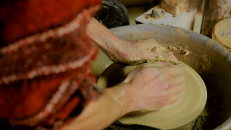 9 shots. professional male potter working in workshop