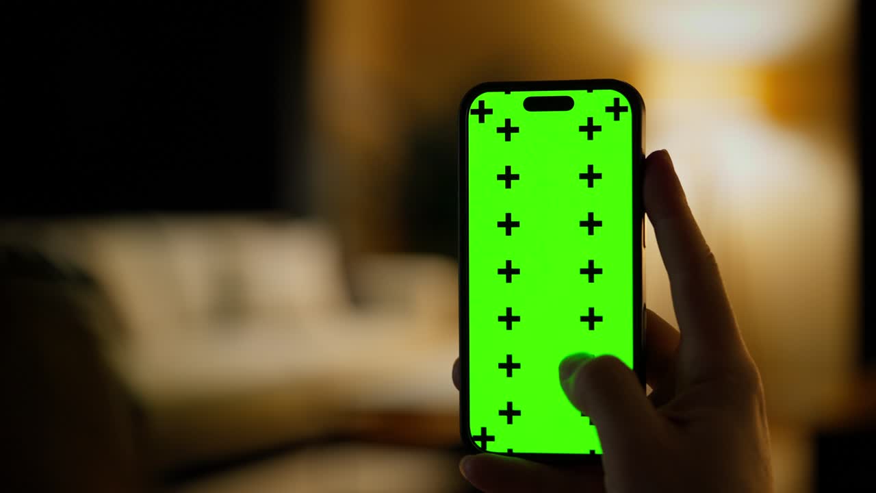 Hand Holding Smartphone with Green Screen Display and Tracking Markers