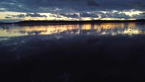 Beautiful-scenery-of-Sant'Antioco-lagoon,-Sardinian-town,-aerial-view,-dusk