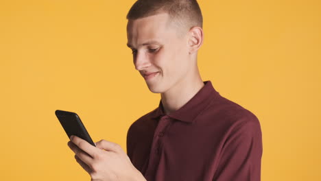 young man looking at his smartphone