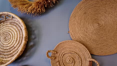 collection of woven baskets and placemats