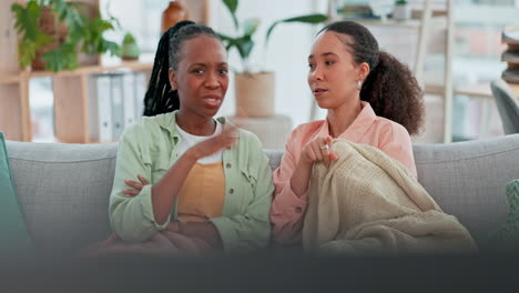 Girl-friends,-watching-tv-and-talking-with-remote