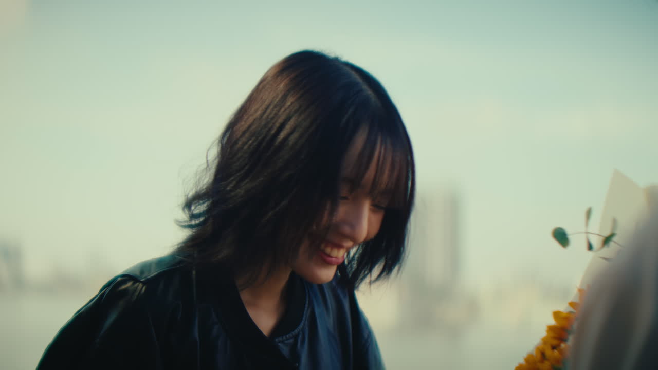 Young Woman Recording a Moment with Flowers