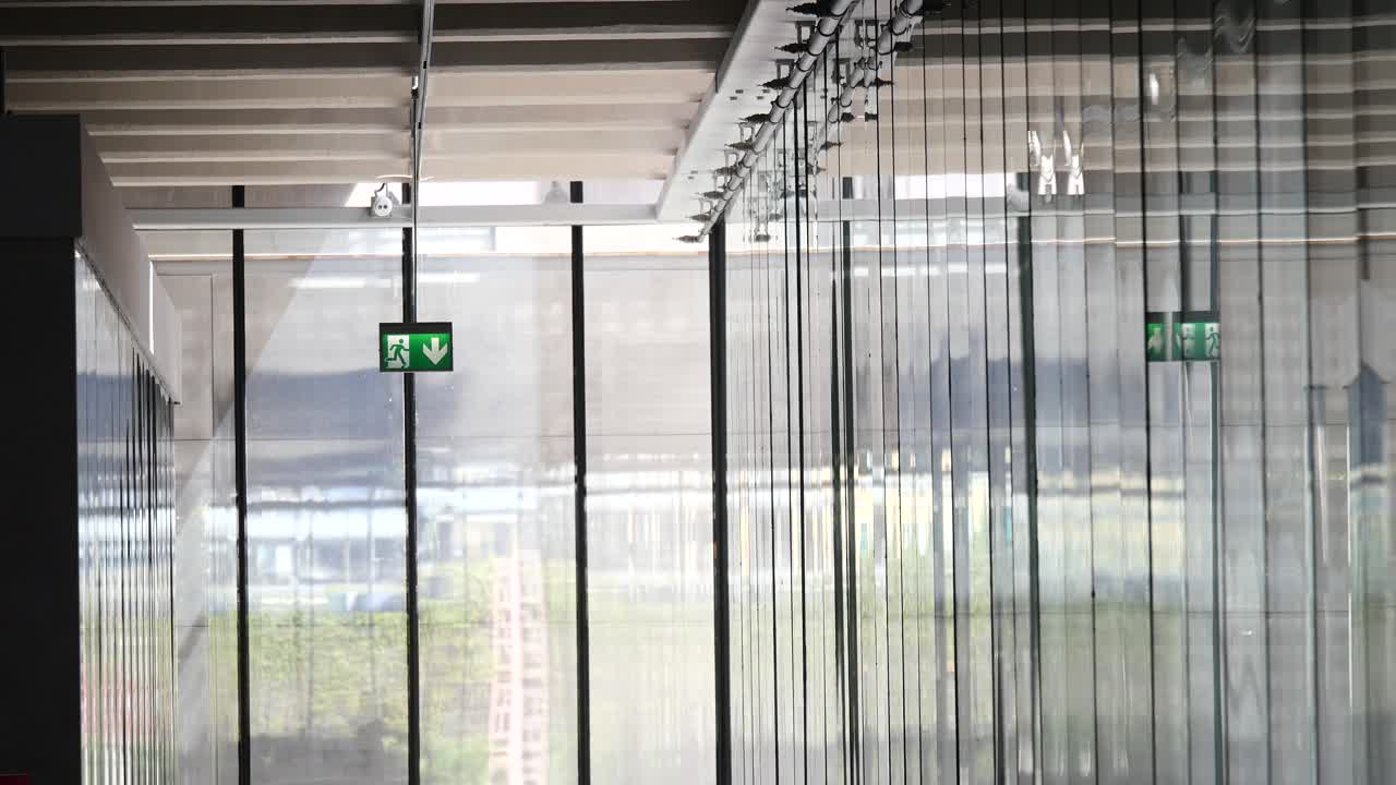 Interior view of a building with exit signs
