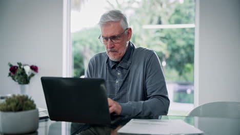 Senior Man Working on Laptop