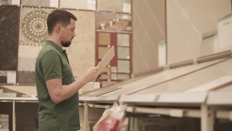 man shopping for tile in a home improvement store