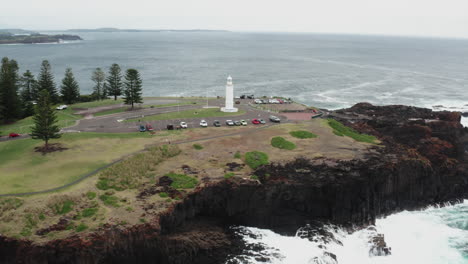 aerial drone shot tracking right around kiama headland on a stormy day in south coast nsw, australia