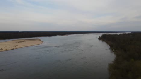 Piles-of-sand-pollute-and-clog-the-river,-animal-protection-on-earth,aerial-shot