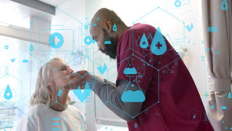 Animation of network of medical icons over diverse male doctor giving senior female patient check up