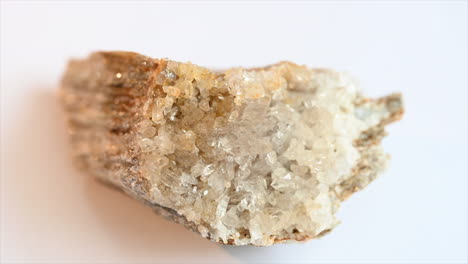 collectible gemstone from the swiss alps, transparent and sparkling crystals, white background