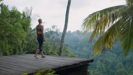 yoga woman practicing prayer pose outdoors in tropical jungle enjoying mindfulness exercise 4k