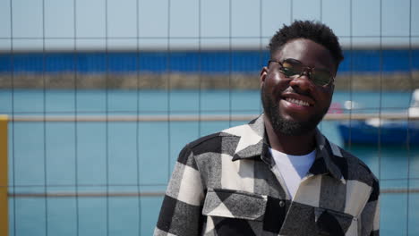 smiling man at the harbor