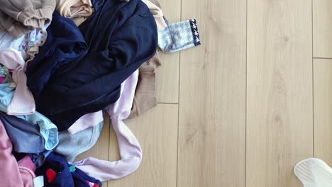 messy pile of clothes on floor