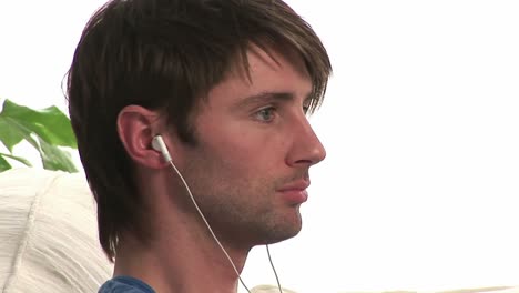 close up of man listening to music