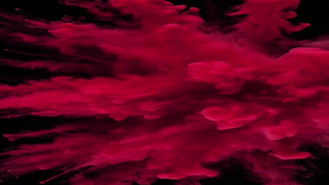Vibrant Red Powder Explosion Against Black Background