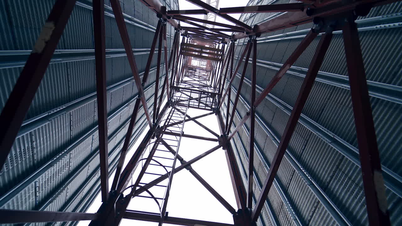 Big factory elevator construction. Storage granary technology tank.