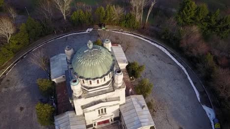 Flying-above-an-old-building-in-Bucharest,-Romania