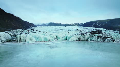 done shot of frozen lake with ice blocks