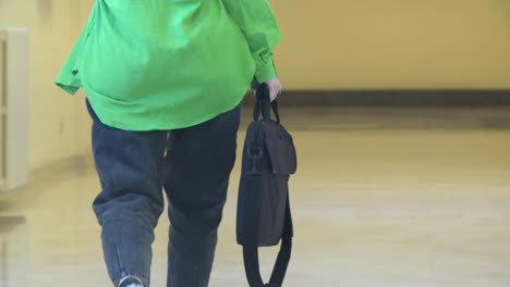 person walking down a hallway
