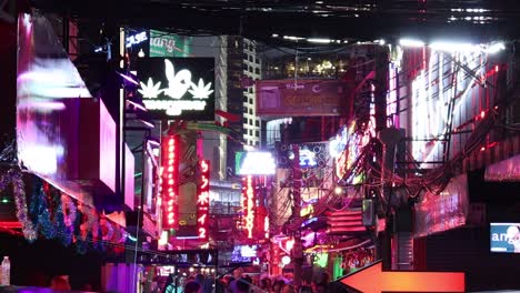 colorful neon lights illuminate a bustling city street