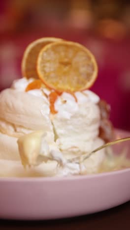 delicious pavlova dessert with orange slices