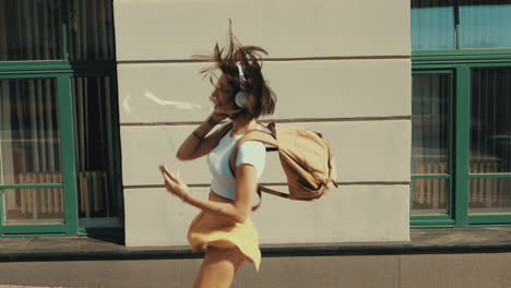 young woman running through city streets